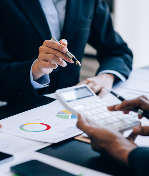Business professionals collaborating on UAE corporate tax compliance and financial accounting documents